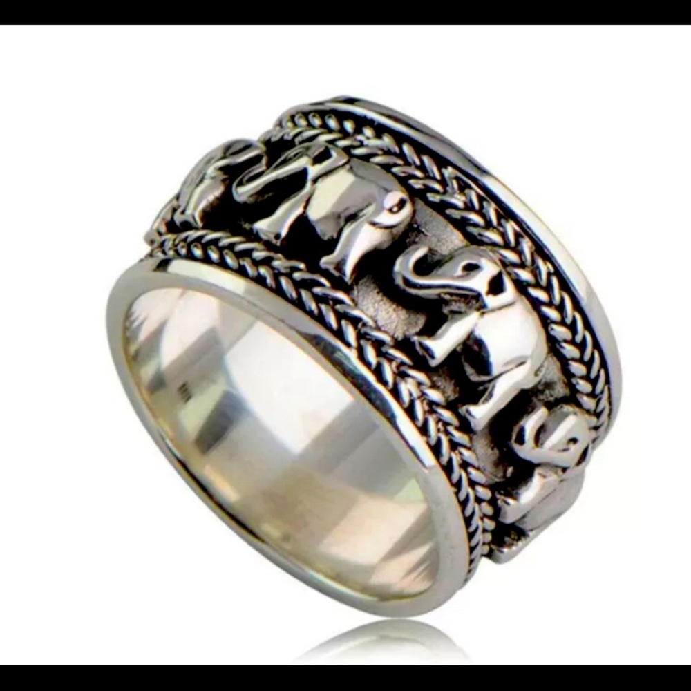 Silver ring with elephant carved patterns